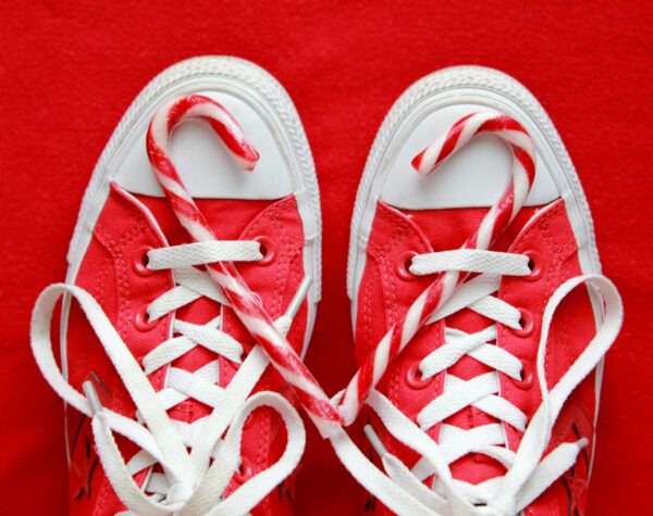 Red and white candy canes on red Converse sneakers